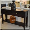 F05. Wooden sofa table with two drawers. 30”h x 48”w x 14”d 